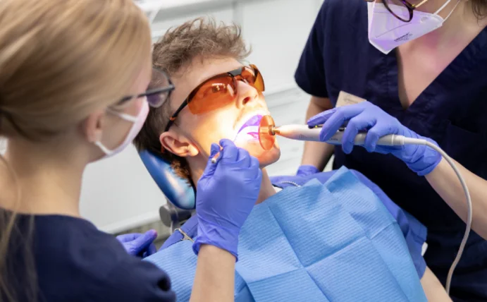 The photo shows a dental treatment.