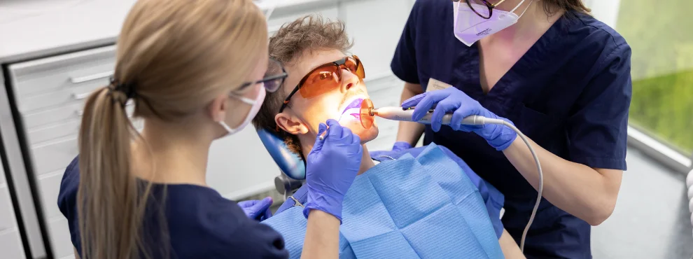 The photo shows a dental treatment.