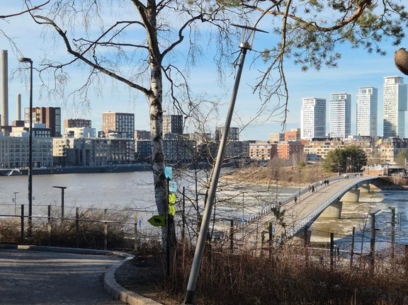 A view of the skyline of the Finnish capital, Helsinki. A tributary flowing into the sea lies between the two banks.