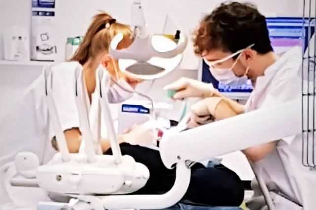 Picture of Gouwen doing dental work.