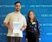 Student John Cheicko holds the Germany Scholarship certificate in his hands. Next to him is his sponsor Caroline Wahl.