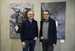 Photo artist Philip Pearce and Prof Dr Stefan Zimmer stand in front of two photographs in the exhibition.