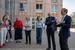 Prof Dr Martin Butzlaff stands in front of the new building and tells the group how the sustainable university building was created.