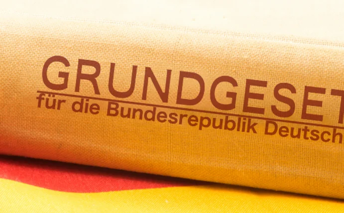 A book lies on its side on a German flag.