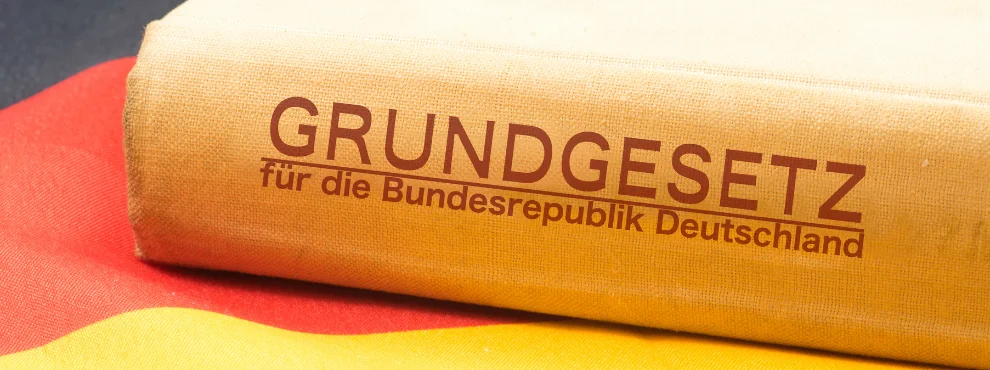 A book lies on its side on a German flag.