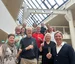 A reason to celebrate: ZNU Standard accreditation (Photo: ZNU) A crowd of people stands on a staircase at Witten/Herdecke University, raising a glass of champagne to celebrate the successful ZNU standard accreditation.
