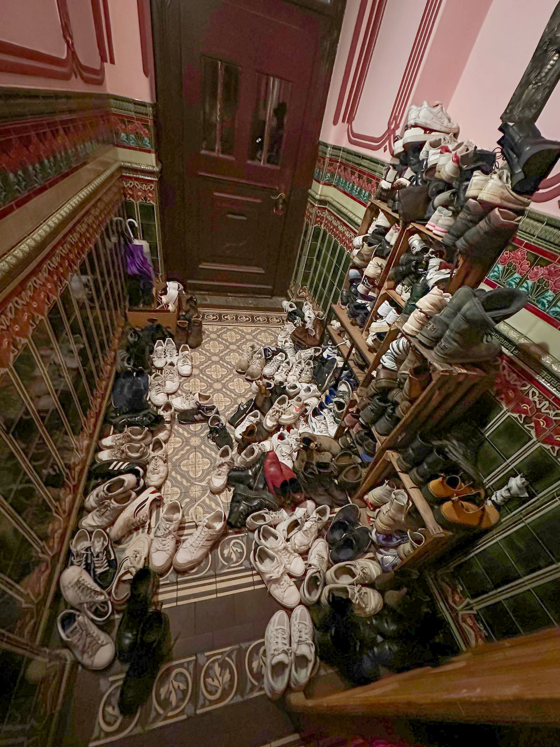 A full house at the flat-share party (Photo: Private) A hallway filled with countless pairs of shoes belonging to party guests.