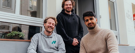 Gruppenbild von drei Männern.