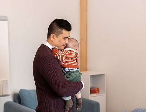 Father with baby in his arms