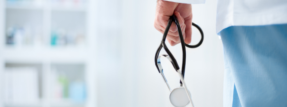 Close-up of a hand holding a stethoscope.