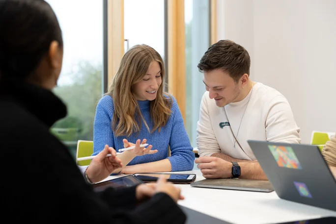 Students work in a study group in a study corridor at the UW/H
